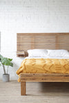 Natural solid wood fluted headboard and bed frame. Extended headboard with floating shelves. Handcrafted in the USA. Rustic, modern design. Heirloom quality furniture.