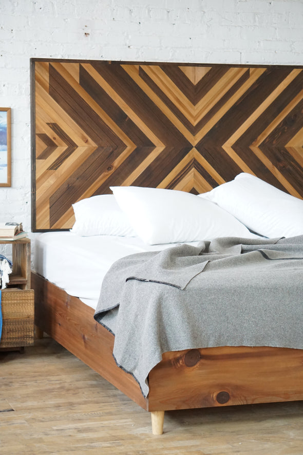 Natural solid wood headboard or bed board with platform bed frame. Unique and eclectic design. Handcrafted in the USA. Heirloom quality furniture. Sustainably sourced materials. Bedroom.