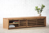 Natural solid wood fluted storage bench. Seating. Shelf. Handcrafted in the USA. Refined rustic design. Modern. Heirloom quality. Sustainably sourced materials. Furniture for home storage. 