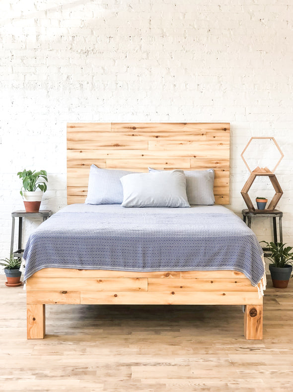 Platform bed frame and headboard set. Made of natural solid wood. Handcrafted in the USA. Heirloom quality furniture. Sustainably sourced materials. 