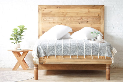 Natural solid wood platform bed frame with spun legs and storage. Solid wood drawers for storage. Vintage style design. Made in the USA.