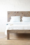 Natural solid wood platform bed frame. Made in the USA. Chevron pattern headboard.