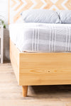 Natural solid wood headboard or bed board with platform bed frame. Unique and eclectic design. Handcrafted in the USA. Heirloom quality furniture. Sustainably sourced materials.